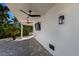 Covered patio with ceiling fans and outdoor lighting at 201 N Harbor Dr, Holmes Beach, FL 34217