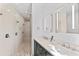 Spa-like shower with multiple shower heads and pebble floor at 201 N Harbor Dr, Holmes Beach, FL 34217