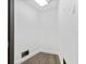 Small storage room with wood flooring and white walls at 201 N Harbor Dr, Holmes Beach, FL 34217