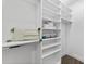 Large walk-in closet with shelving and hanging space at 201 N Harbor Dr, Holmes Beach, FL 34217