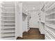 Large walk-in closet with custom shelving and hanging space at 201 N Harbor Dr, Holmes Beach, FL 34217