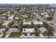 Aerial view of a home with a pool, located near the beach in a residential neighborhood at 205 82Nd St # East, Holmes Beach, FL 34217