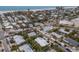Aerial view of a house with a pool, situated near the beach in a residential setting at 205 82Nd St # East, Holmes Beach, FL 34217