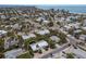 Aerial view showcasing a house's location near the beach, surrounded by other homes at 205 82Nd St # East, Holmes Beach, FL 34217
