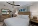 Serene bedroom with a king-size bed and a ceiling fan at 205 82Nd St # East, Holmes Beach, FL 34217