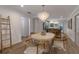 Round dining table with four chairs, located next to kitchen at 205 82Nd St # East, Holmes Beach, FL 34217