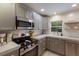 Modern kitchen with stainless steel appliances and a light gray color scheme at 205 82Nd St # East, Holmes Beach, FL 34217