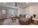 Spacious living room with L-shaped sofa and wood coffee table at 205 82Nd St # East, Holmes Beach, FL 34217