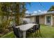 Outdoor patio with table, chairs, and grill at 205 82Nd St # East, Holmes Beach, FL 34217
