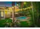Night view of a relaxing pool area with string lights at 205 82Nd St # East, Holmes Beach, FL 34217