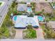 Bird's eye view of a blue house with two pools at 215 75Th St, Holmes Beach, FL 34217