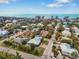 Aerial view of beachside neighborhood, showing homes and ocean at 215 75Th St, Holmes Beach, FL 34217