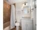 Clean bathroom with updated vanity, shower/tub combo, and tile flooring at 215 75Th St, Holmes Beach, FL 34217