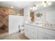 Bathroom with double vanity, large shower, and tile flooring at 215 75Th St, Holmes Beach, FL 34217