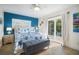 Main bedroom with a queen bed and access to private patio at 215 75Th St, Holmes Beach, FL 34217