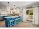 Open kitchen with island seating and sliding glass doors to patio at 215 75Th St, Holmes Beach, FL 34217