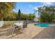 Inviting pool area with patio furniture and barbecue grill at 215 75Th St, Holmes Beach, FL 34217