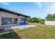 Backyard patio with view into the house and grassy area at 21970 Cellini Ave, Port Charlotte, FL 33952