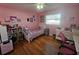 Bright bedroom with twin bed, desk, and bookcase at 2468 Nodosa Dr, Sarasota, FL 34232