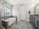 Elegant bathroom with soaking tub and double vanity at 2511 Prospect St, Sarasota, FL 34239
