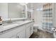 Bathroom boasts double sinks, granite countertop, and a shower/tub combo at 2511 Prospect St, Sarasota, FL 34239