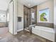 Spa-like bathroom with walk-in shower and soaking tub at 2511 Prospect St, Sarasota, FL 34239