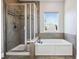 Clean bathroom with a shower and a bathtub at 2511 Prospect St, Sarasota, FL 34239