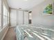 Bright bedroom with a seashell patterned bedspread and plenty of closet space at 2511 Prospect St, Sarasota, FL 34239