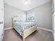Charming bedroom with a white bed frame and starfish patterned bedding at 2511 Prospect St, Sarasota, FL 34239