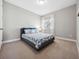 Cozy bedroom featuring a gray platform bed and blue fish patterned bedding at 2511 Prospect St, Sarasota, FL 34239