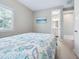 Comfortable bedroom with a seashell patterned bedspread and ensuite bathroom access at 2511 Prospect St, Sarasota, FL 34239
