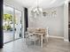 Bright dining room with wooden table and access to patio at 2511 Prospect St, Sarasota, FL 34239