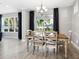 Dining area with wooden table and chairs near sliding doors at 2511 Prospect St, Sarasota, FL 34239