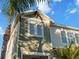 Close-up of house exterior, showcasing green shake siding and windows at 2511 Prospect St, Sarasota, FL 34239