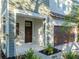 House entrance with brown door and green shake siding at 2511 Prospect St, Sarasota, FL 34239