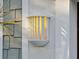 White exterior light fixture with a yellow glow at 2511 Prospect St, Sarasota, FL 34239