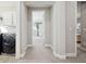 Bright hallway with carpet and access to bedrooms and laundry at 2511 Prospect St, Sarasota, FL 34239