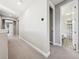 Clean hallway with carpet and access to bedrooms and bath at 2511 Prospect St, Sarasota, FL 34239