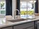 Kitchen island with sink and granite countertop at 2511 Prospect St, Sarasota, FL 34239