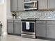 Stainless steel range and microwave in gray kitchen at 2511 Prospect St, Sarasota, FL 34239