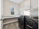 Laundry room with modern washer and dryer and countertop at 2511 Prospect St, Sarasota, FL 34239
