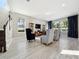 Bright living room with comfy seating and large windows at 2511 Prospect St, Sarasota, FL 34239