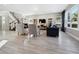Bright living room featuring hardwood floors, comfortable seating, and a large TV at 2511 Prospect St, Sarasota, FL 34239