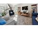 Sunlit living room with comfy seating and a large TV at 2511 Prospect St, Sarasota, FL 34239