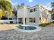 House with a kidney-shaped pool and paved patio at 2511 Prospect St, Sarasota, FL 34239