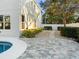 Landscaped side yard with stone pathway and pool at 2511 Prospect St, Sarasota, FL 34239