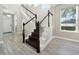 Stylish staircase with dark wood and white railings at 2511 Prospect St, Sarasota, FL 34239