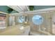 Bright and luxurious bathroom with a glass enclosed shower and unique etched glass window at 279 Robin Dr, Sarasota, FL 34236