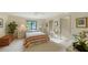 Serene bedroom with a comfy bed, ceiling fan, and lots of natural light at 279 Robin Dr, Sarasota, FL 34236
