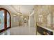 Spacious foyer with tile flooring, stone fireplace, and arched doorway leading to other rooms at 279 Robin Dr, Sarasota, FL 34236